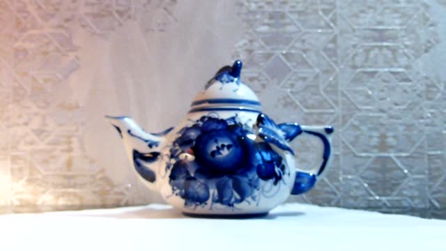 Teapot. Home tableware in Russian traditional Gzhel style. Gzhel - Russian folk craft of ceramics and production porcelain and a kind of Russian folk painting.