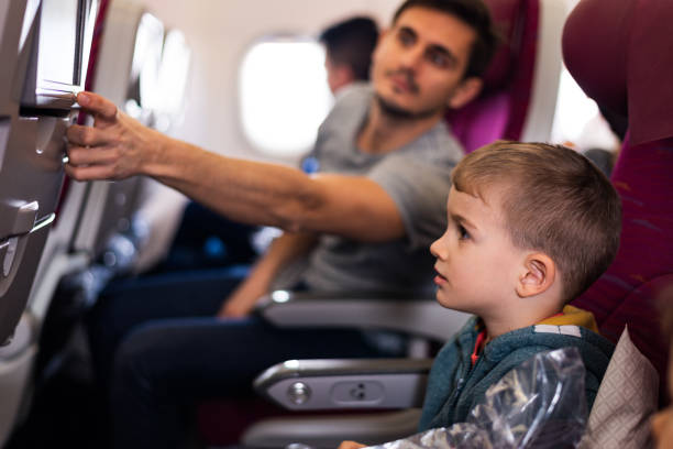 istock Family traveling by plane 1303834036
