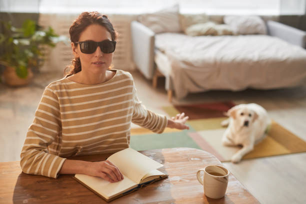 istock Blind Woman at Home with Guide Dog 1303834101