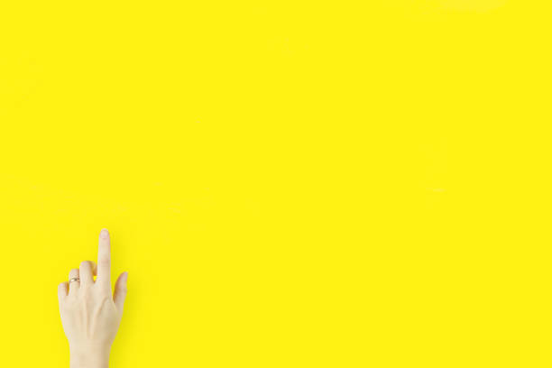 istock female hand touching or pointing to something. Index Finger Pointing Forward 1303835489