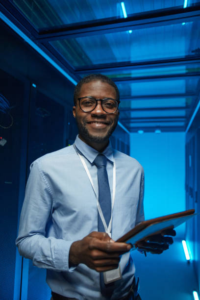 istock Smiling African American Man in Server Room 1303835910