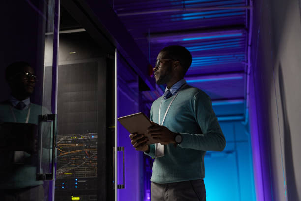 istock African American IT Specialist in Server Room 1303835945