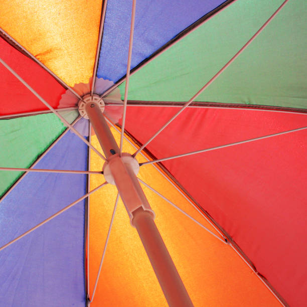 istock Colorful beach umbrella 1303836831