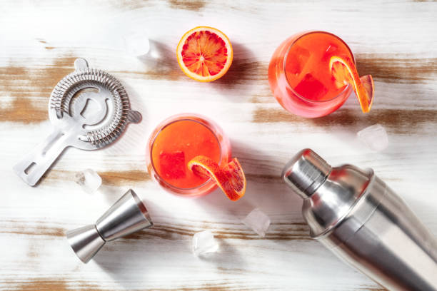 istock Orange cocktail with blood oranges, a shaker, a jigger, and a strainer 1303837167