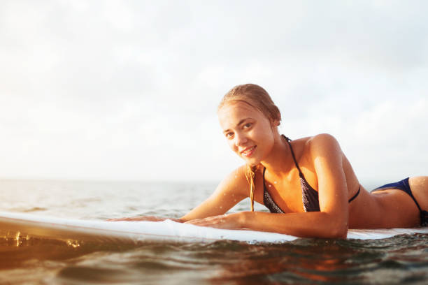 istock young surfer woman 1303838154