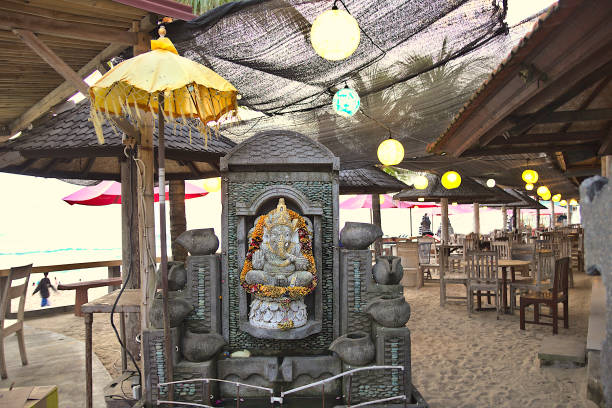 View from the street of Cafes, Restaurant and Beach Bars at Batu Bolong Beach in Canggu, Bali, Indonesia.
