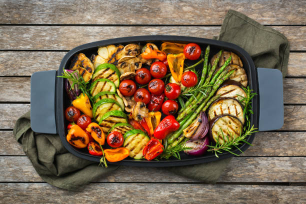 istock Grilled vegetables in a pan. Summer vegan plating, charcuterie 1303839642