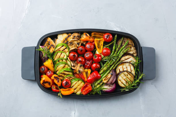 istock Grilled vegetables in a pan. Summer vegan plating, charcuterie 1303839663