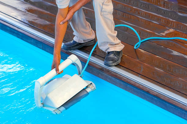 istock Hotel staff african worker cleaning the pool 1303839839