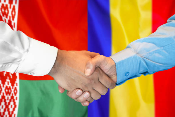 istock Handshake on Belarus and Moldova flag background. Support concept. 1303840002