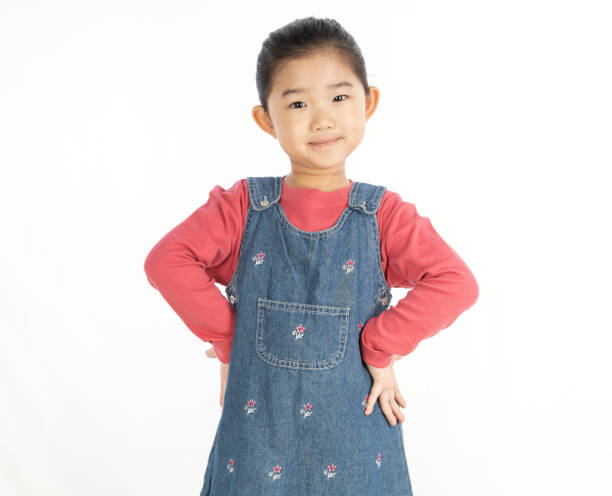 istock Little Girl Hand on Hip on White Background 1303840072