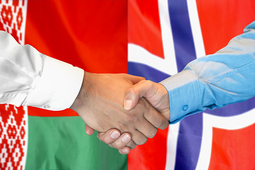 Business partnership shaking hands (handshake). Communication teamwork deal and marketing concept.