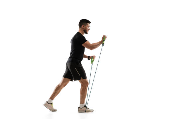 istock Caucasian professional sportsman training isolated on white studio background. Muscular, sportive man practicing. 1303841307