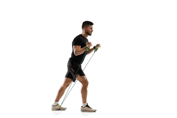 istock Caucasian professional sportsman training isolated on white studio background. Muscular, sportive man practicing. 1303841309