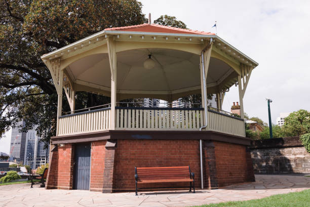 Brick and wooden rotunda in a city park.
