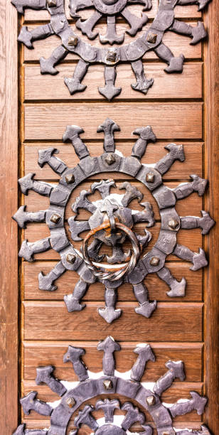 Forged sun and an old doorknob. Medieval decor
