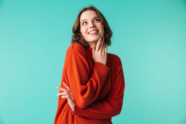 istock Happy woman standing isolated over blue background 1303843824