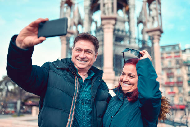 istock Senior Enjoying Sightseeing Switzerland And Taking Selfie 1303844840