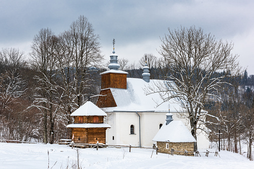 Picturesque Lopienka Orthodox Church in Bieszczady Mountains in Poland. Snowy Winter Wonderland.