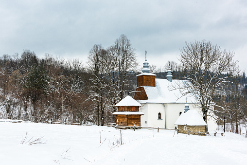 Picturesque Lopienka Orthodox Church in Bieszczady Mountains in Poland. Snowy Winter Wonderland.