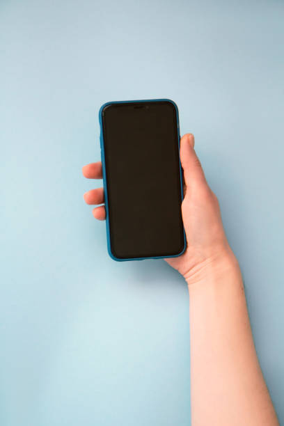 istock Woman's hand holding and smart phone on smart phone 1303846468