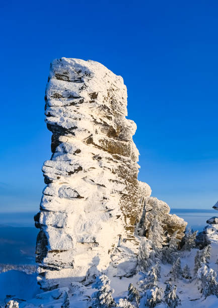 istock the rock is covered with snow in winter 1303850479