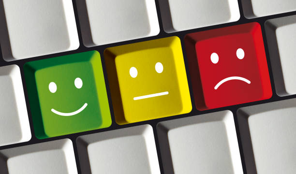 istock Feedback Smiley Buttons on Laptop Keyboard - Concept Review 1303853892