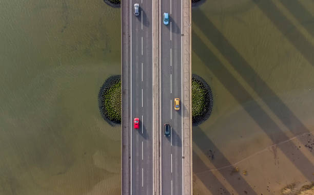 istock View from a drone looking down on traffic on a road bridge crossing a large river in Suffolk, UK 1303854379
