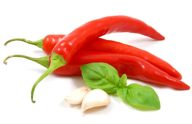 istock Red chili peppers with garlic and basil 1303856210