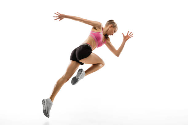 istock Caucasian professional female runner, athlete training isolated on white studio background. Copyspace for ad. 1303857492