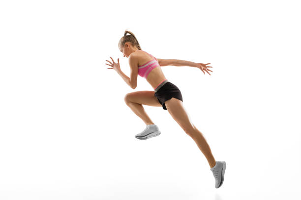 istock Caucasian professional female runner, athlete training isolated on white studio background. Copyspace for ad. 1303857494
