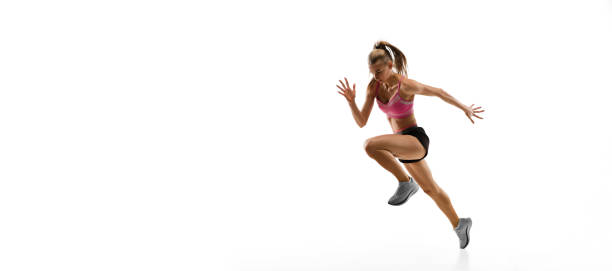 istock Caucasian professional female runner, athlete training isolated on white studio background. Copyspace for ad. 1303857525