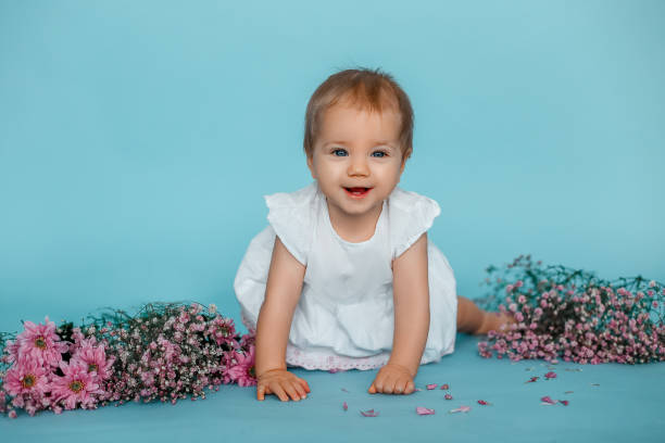 istock baby with flowers 1303857742