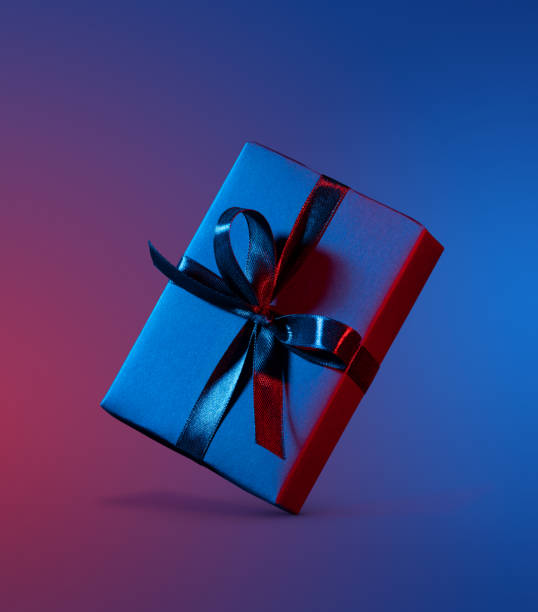 istock Blue red gift box close up on colorful background 1303859987