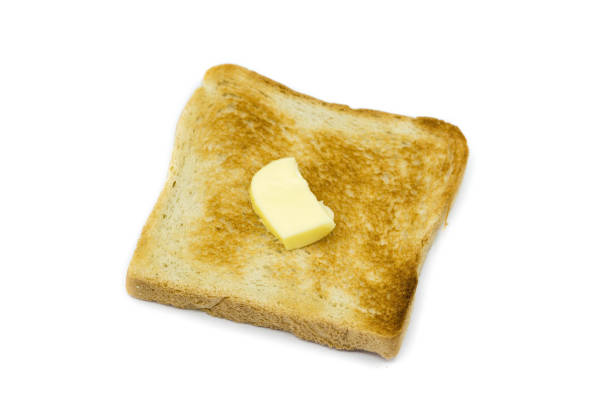 istock Toast bread with butter isolated on white background 1303861250