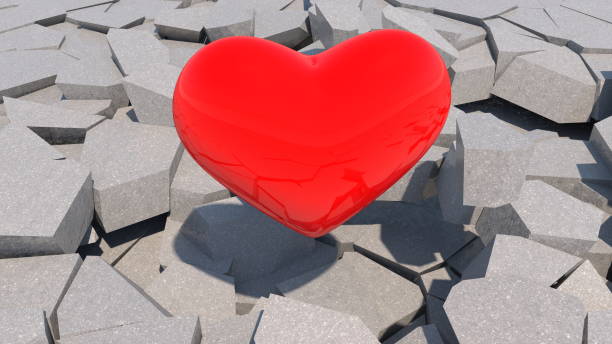 istock Red heart on cracked floor 1303861396