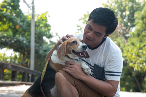 istock Young man enjoying a beautiful day with a dog 1303864505
