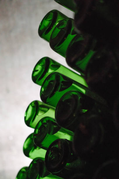 istock Green bottles of wine or champagne 1303868920