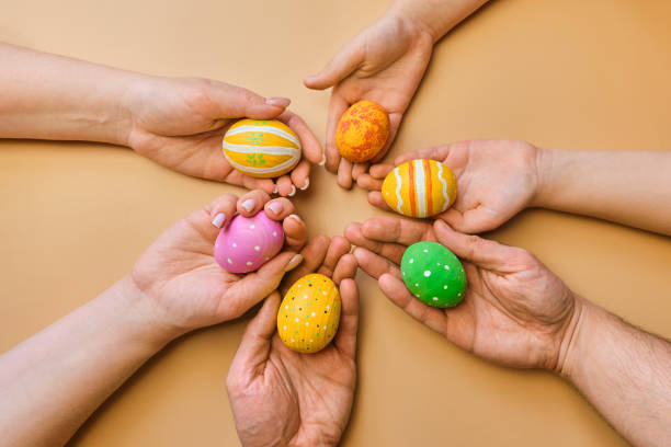 istock Colorful easter eggs in child hands after egg-hunt 1303870587