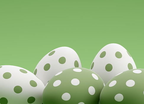 Easter polka dot eggs lying on green background. 3d render