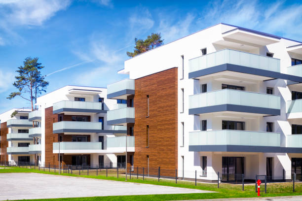 istock New modern complex of white apartment buildings 1303875942