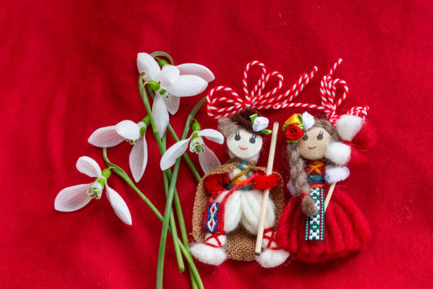 Martenitsa - traditional Bulgarian custom - red background with snowdrops