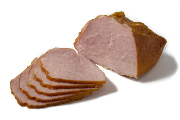 istock Appetizing baked sliced meat isolated on white background close-up 1303878655