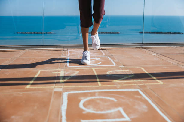 istock Kids playing hopscotch 1303878690