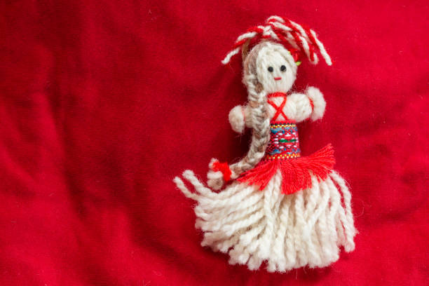 istock Martenitsa - traditional Bulgarian custom - red background with snowdrops 1303878829