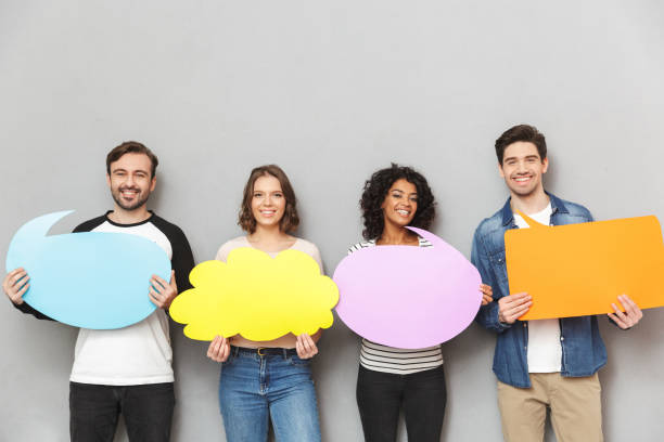 istock Emotional group of friends holding speech and thoughtful bubbles. 1303879921