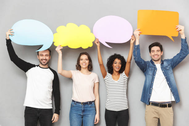 istock Emotional group of friends holding speech and thoughtful bubbles. 1303880029