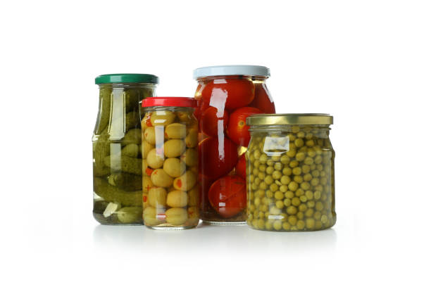 istock Jars with different pickled food isolated on white background 1303880316
