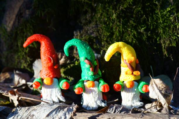 istock Figures of colorful dwarfs in the forest. 1303884043