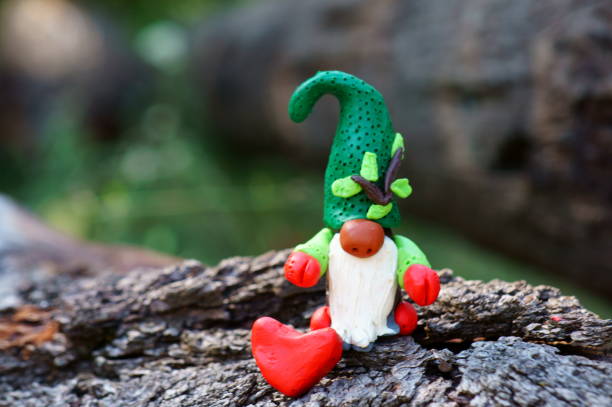 istock Figurine of a forest dwarf made of plasticine. 1303884259